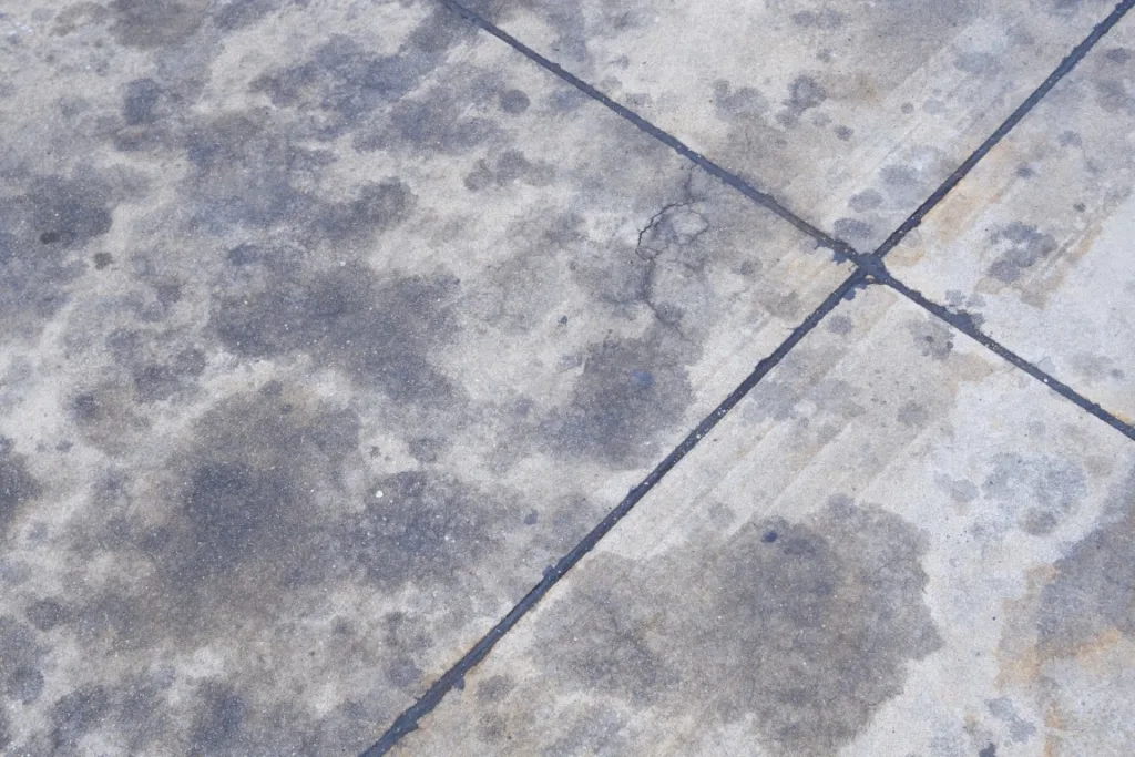 Removing Oil Stains With Professional Pressure Washing 2 oil stain 1